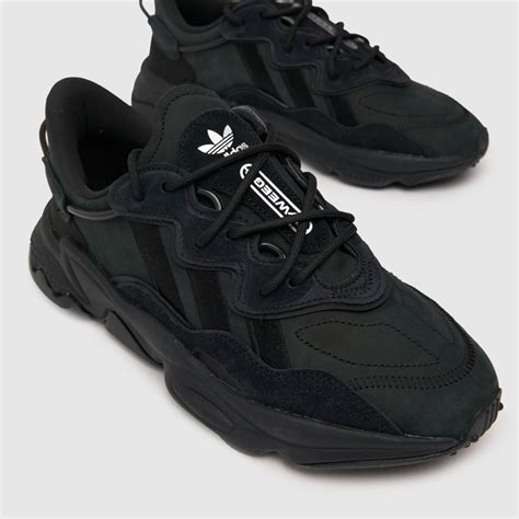 black adidas ozweego trainers